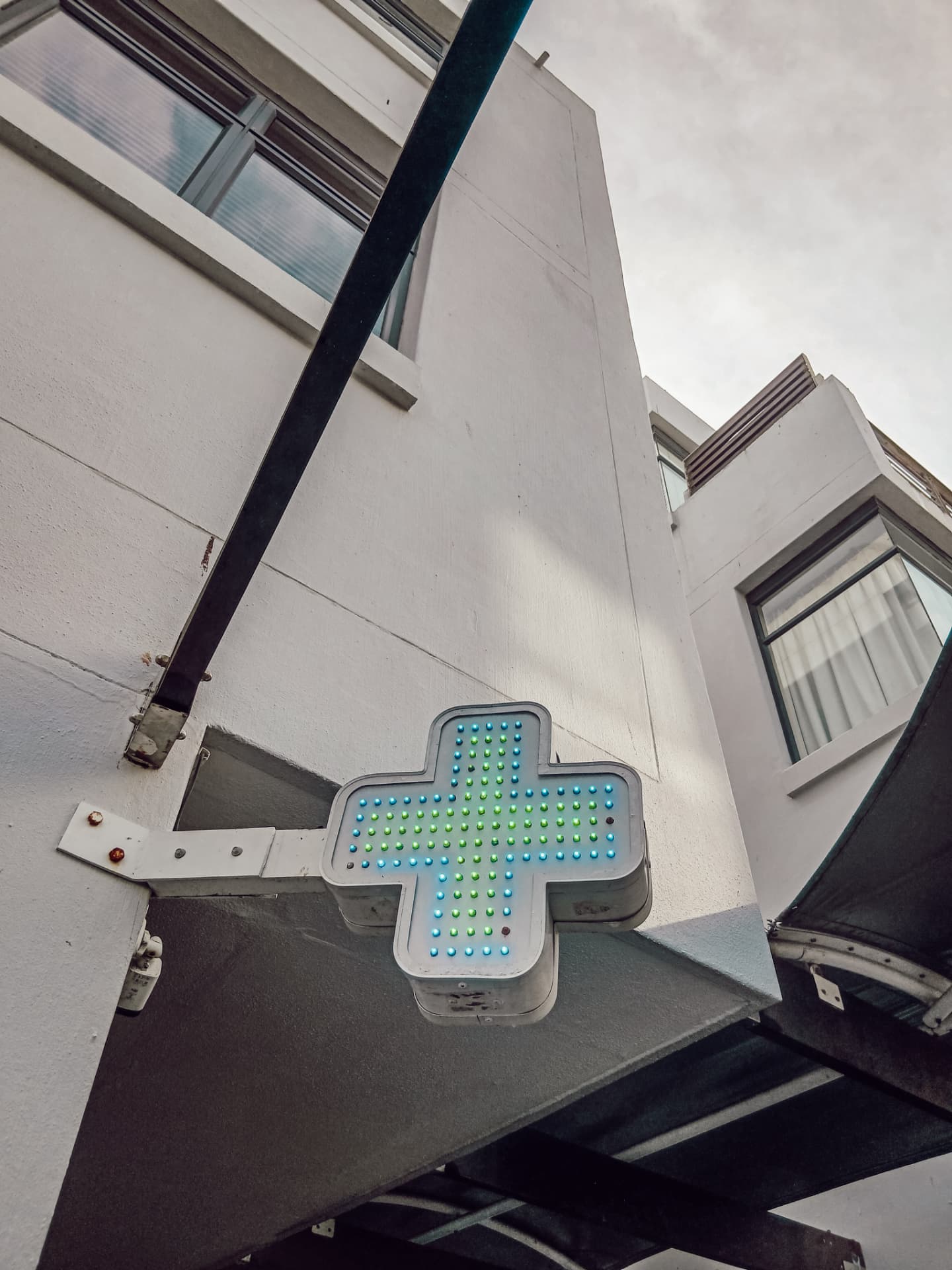 The green pharmacy cross outside the shop